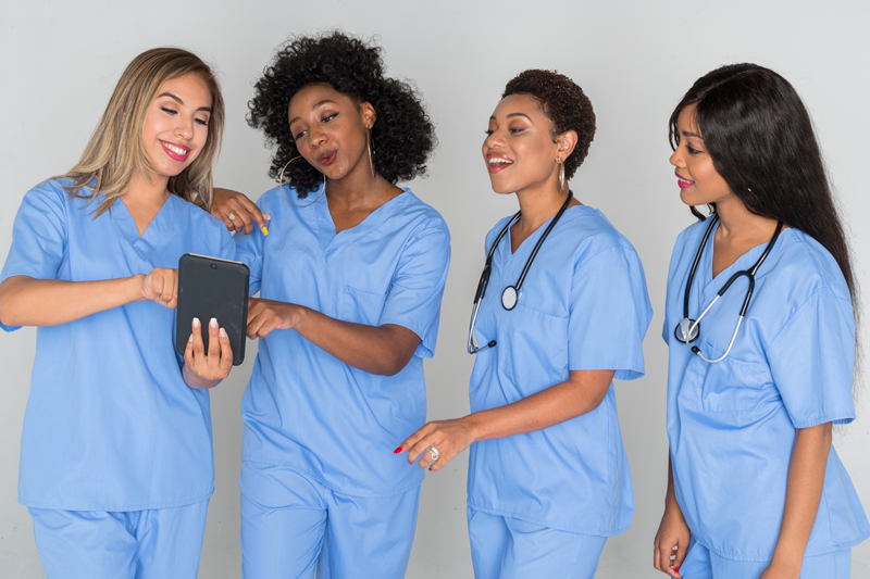 Hospital POS payroll deductions photo of nurses with tablet